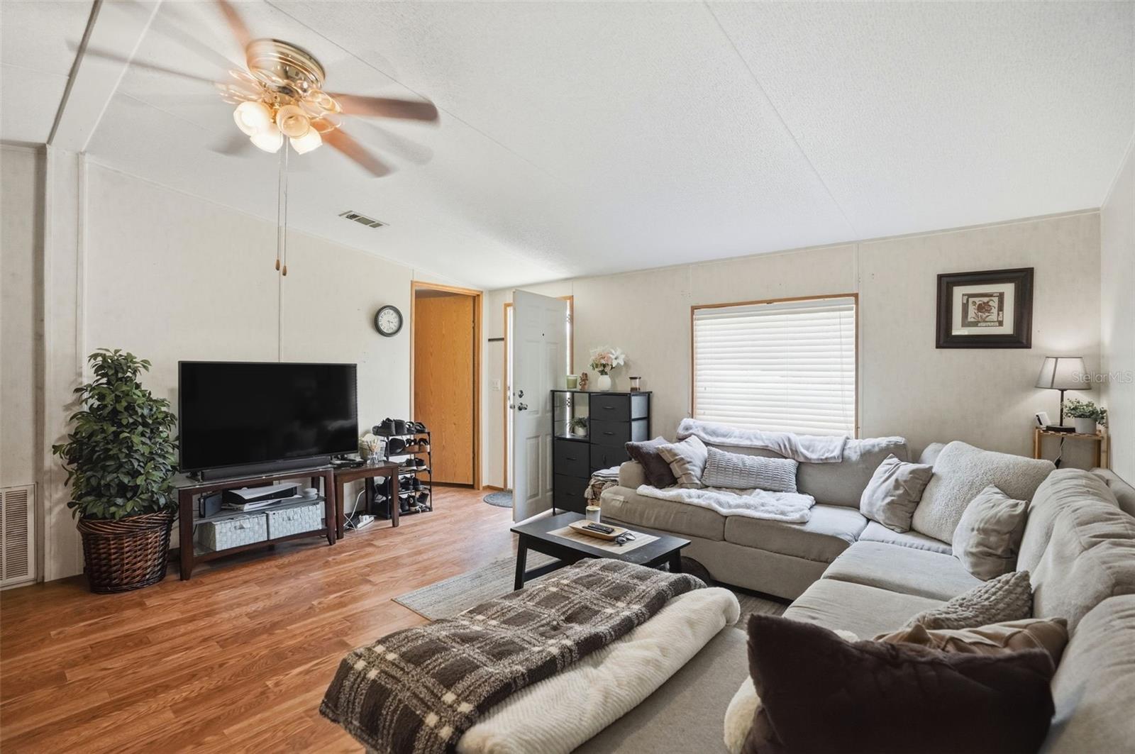 Living Room in 2/2 Manufactured Home Built in 2006 with 2 Primary Bedrooms/Bathrooms