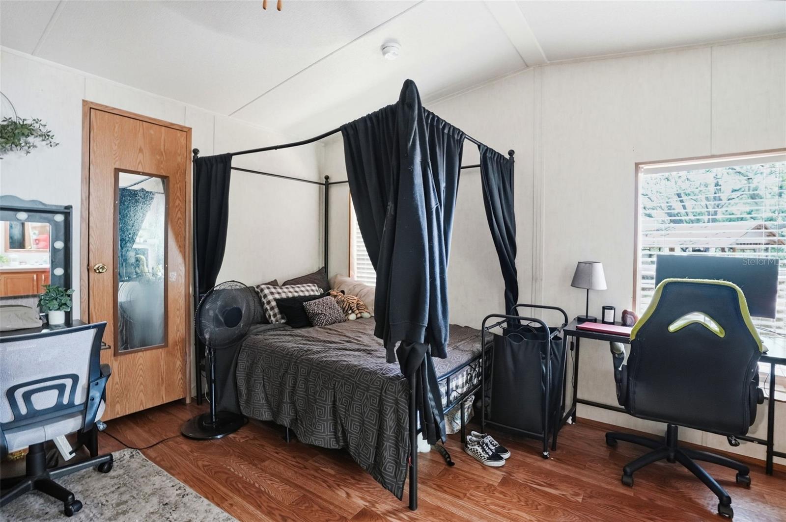 Primary Bedroom with Walk In Closet and Ensuite Bathroom off of Dining Room/Living Room in Dining Room in 2/2 Manufactured Home Built in 2006
