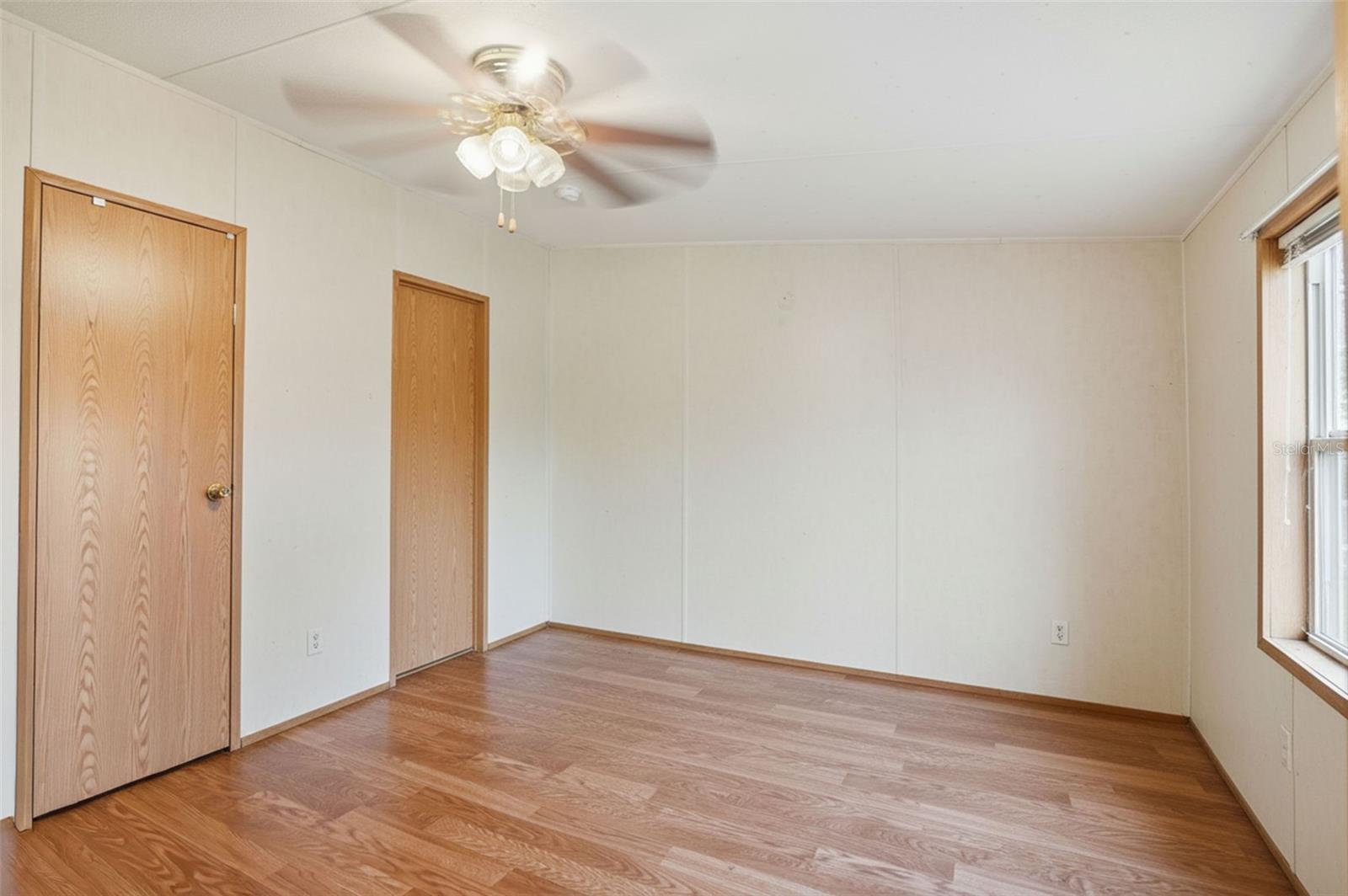 Primary Bedroom near Front Entry with Large Closet and Ensuite Bathroom in 2/2 Manufactured Home Built in 2006