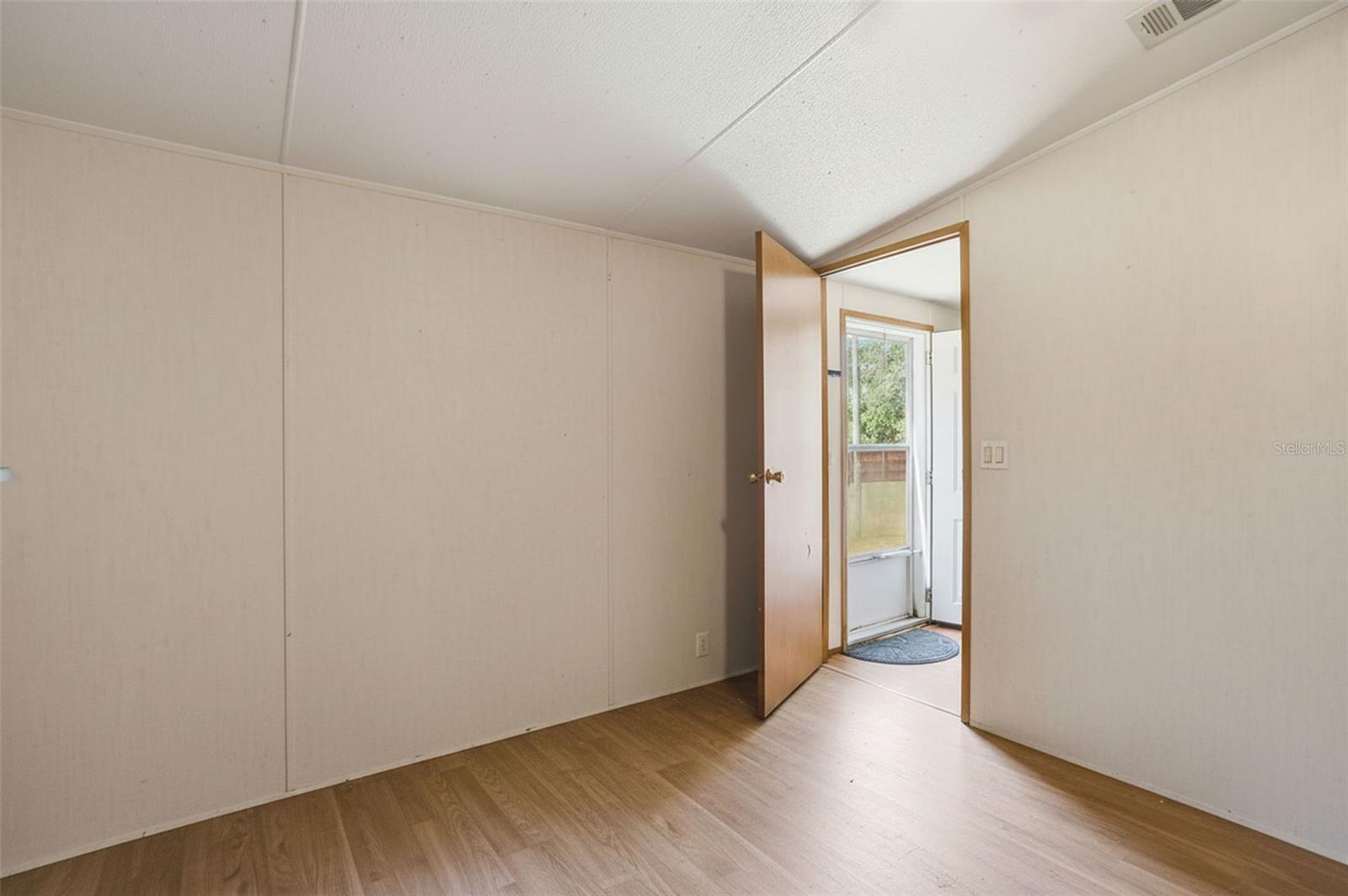 Primary Bedroom near Front Entry with Large Closet and Ensuite Bathroom in 2/2 Manufactured Home Built in 2006