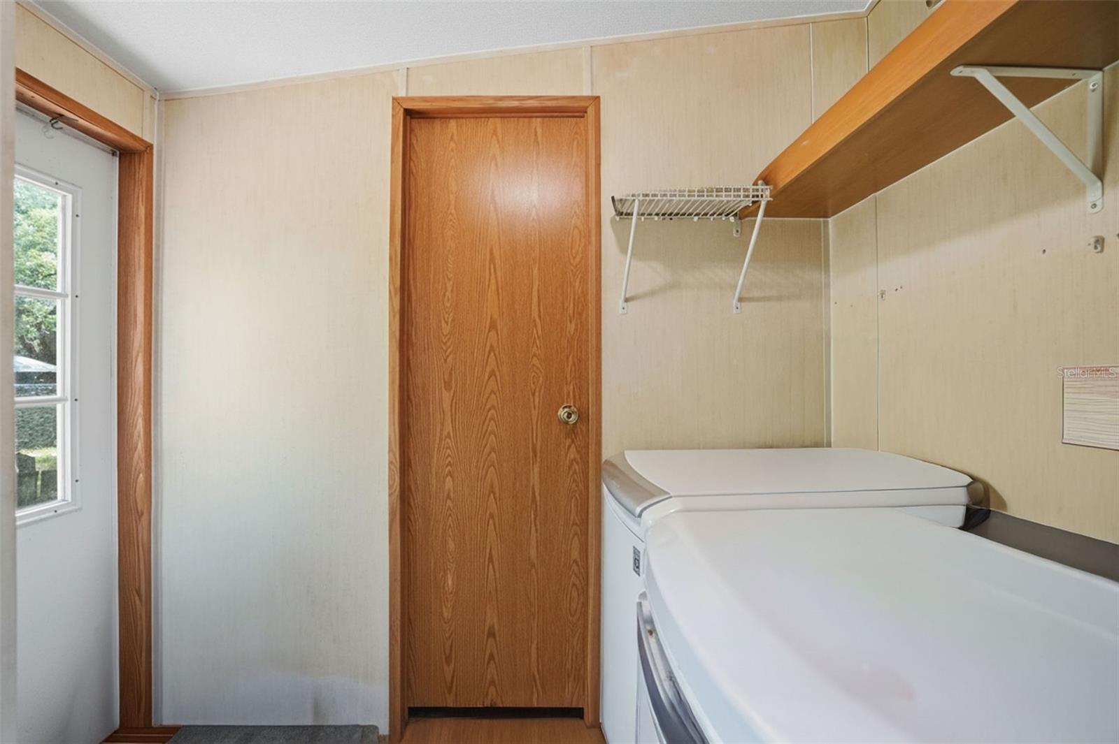 Laundry Area in 2/2 Manufactured Home built in 2006 located near Back Door and
