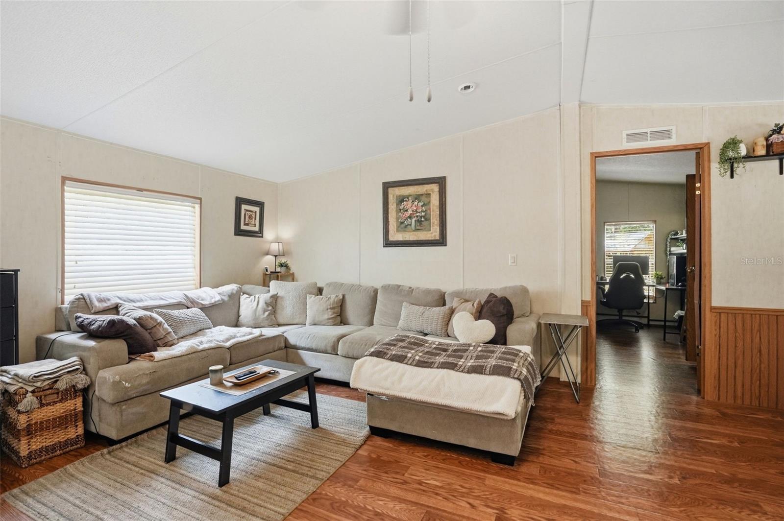 Living Room in 2/2 Manufactured Home Built in 2006 with 2 Primary Bedrooms
