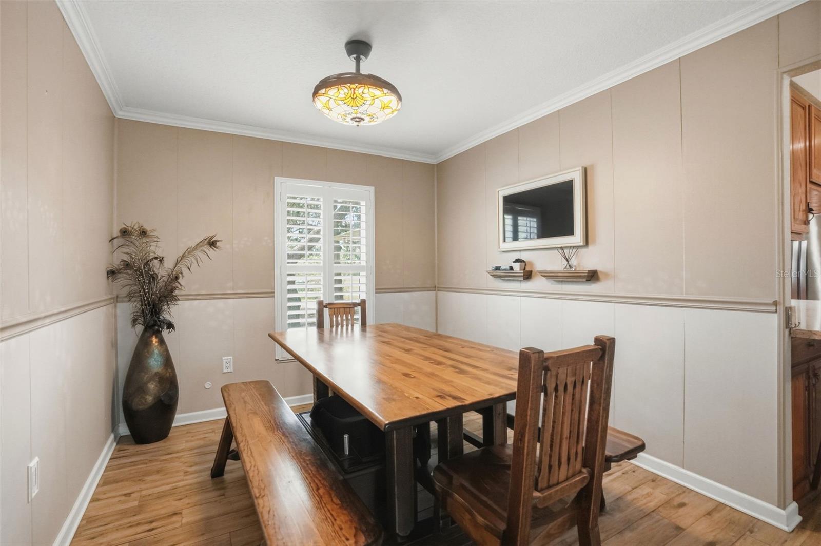 Dining Room open to Living Room with Wood-Look Tile Floors