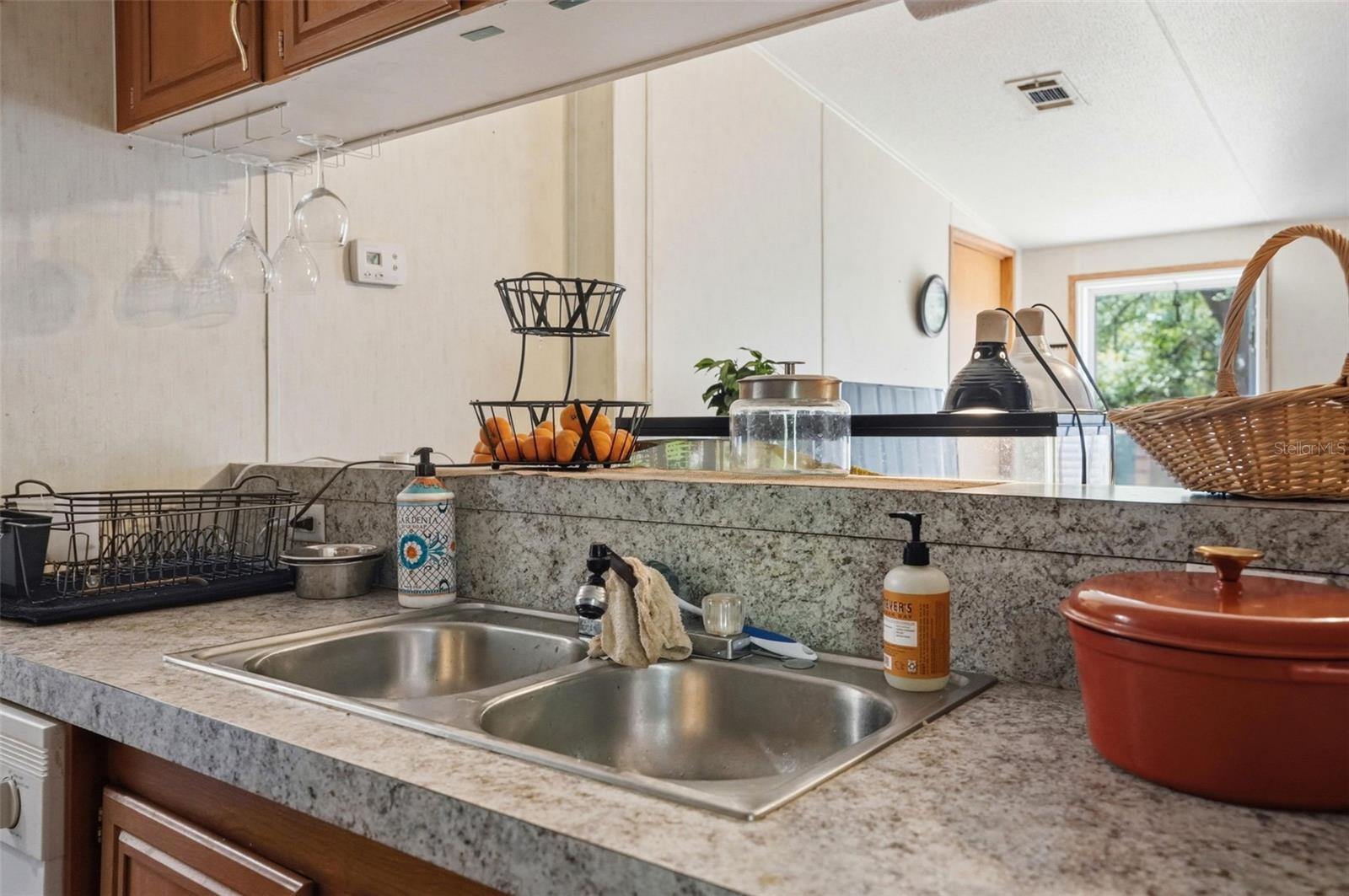 Kitchen in 2/2 Manufactured Home Built in 2006 with 2 Primary Bedrooms