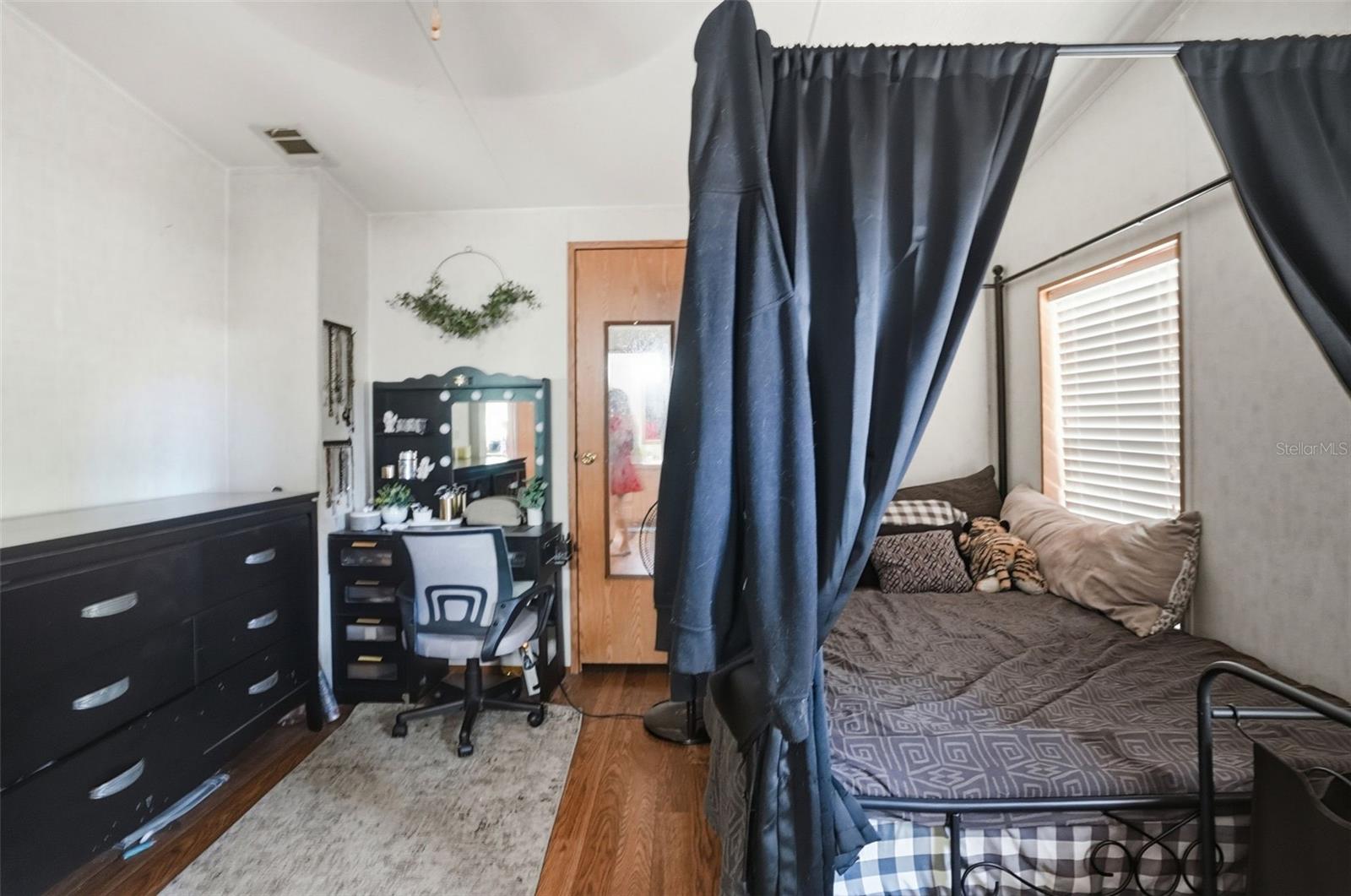 Primary Bedroom with Walk In Closet and Ensuite Bathroom off of Dining Room/Living Room in Dining Room in 2/2 Manufactured Home Built in 2006