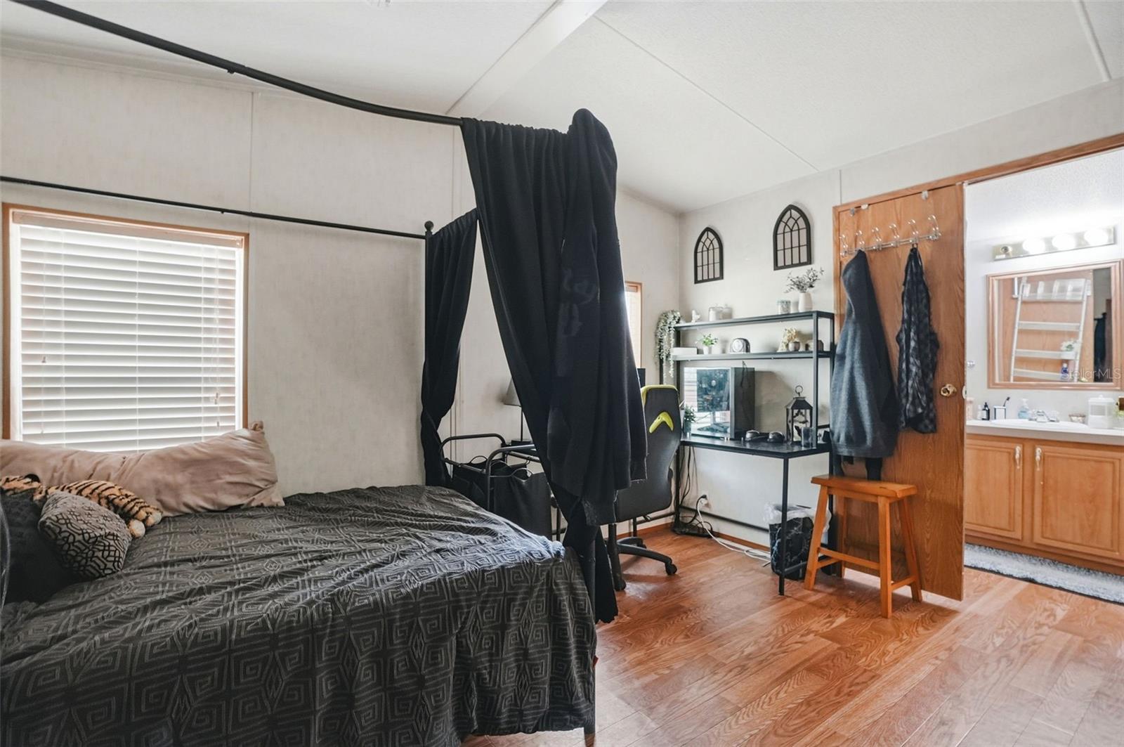 Primary Bedroom with Walk In Closet and Ensuite Bathroom off of Dining Room/Living Room in Dining Room in 2/2 Manufactured Home Built in 2006