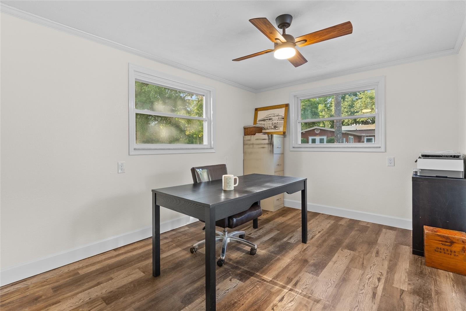 Office that overlooks the pool and yard