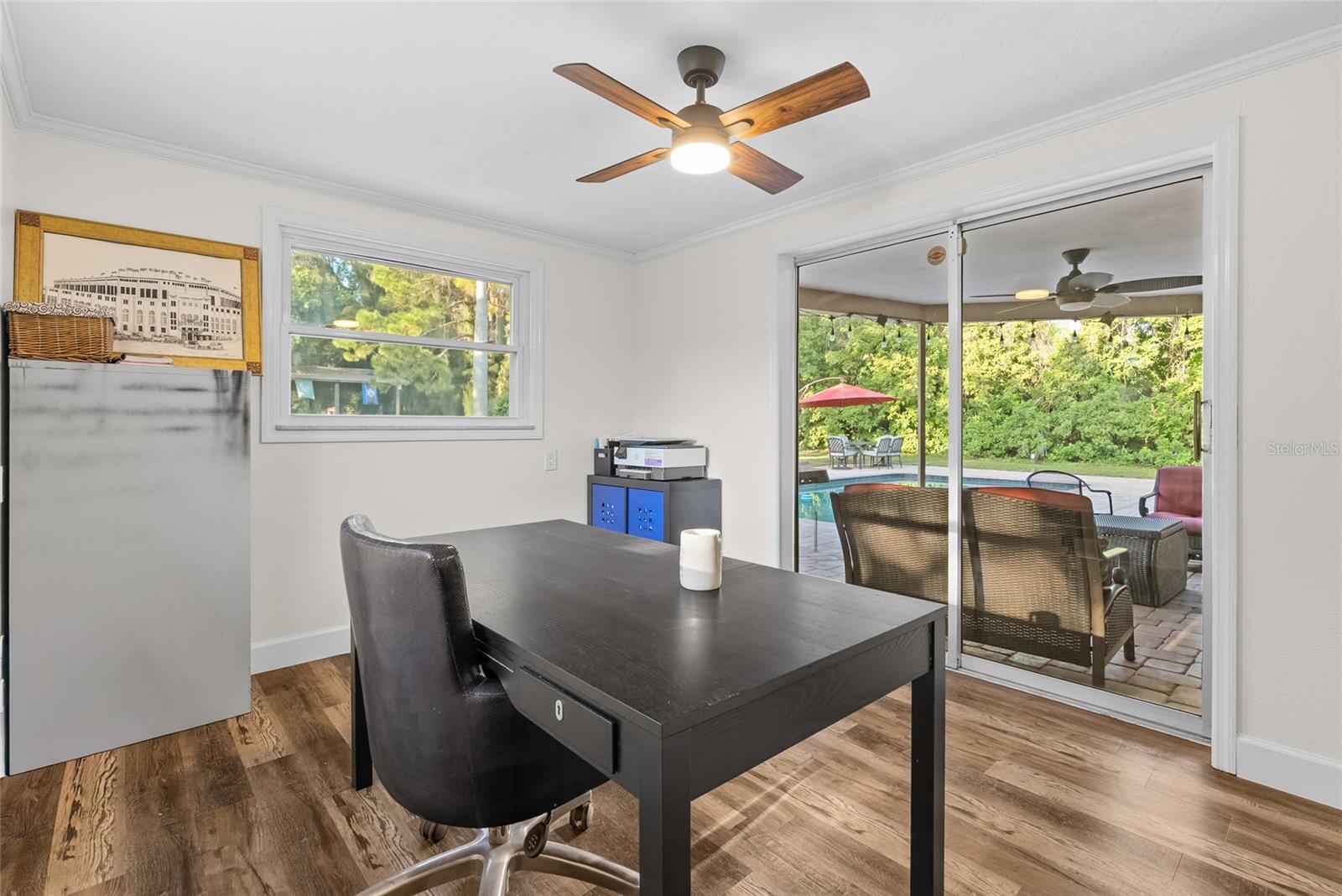 Office that overlooks the pool and yard