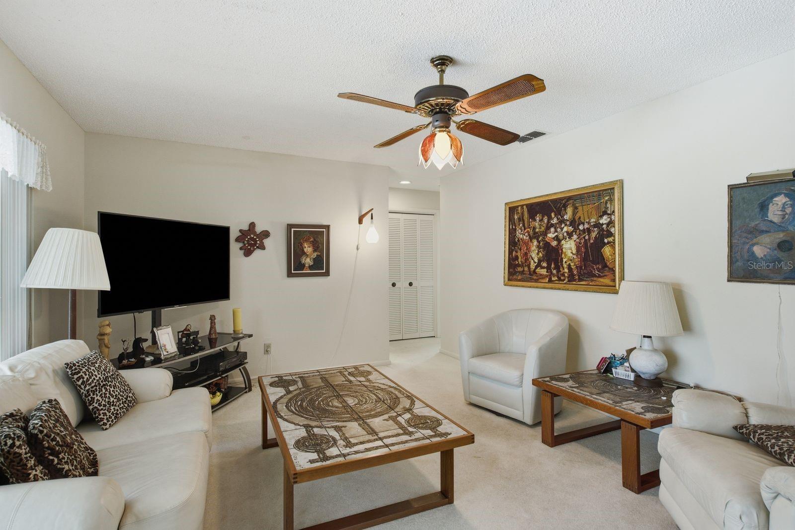 Family room with entry to Guest bedroom and Pool bath