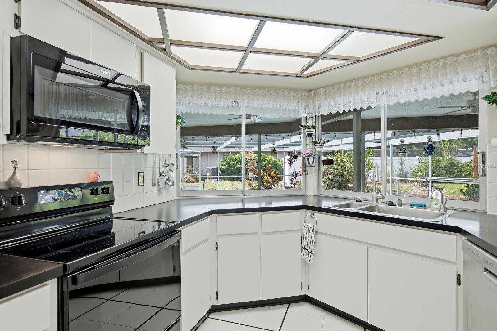 Kitchen with pass through windows to patio