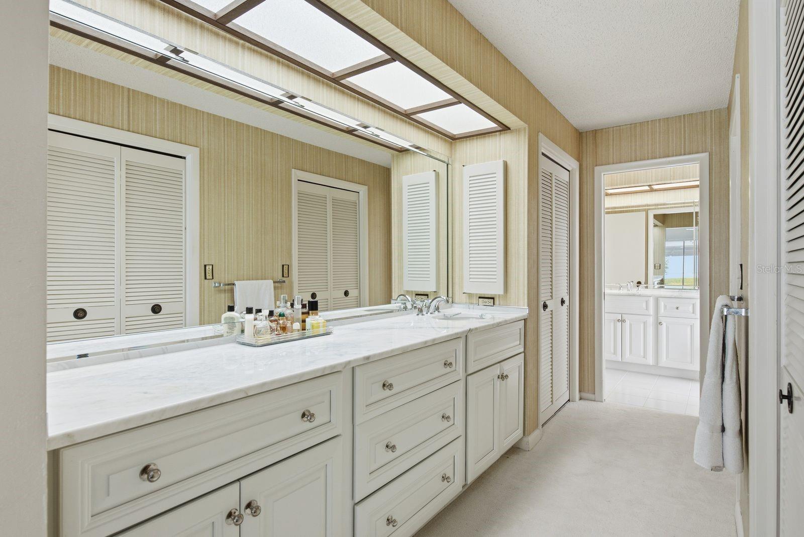 Primary Ensuite with dual vanities, linen closet and dual walk in closets.