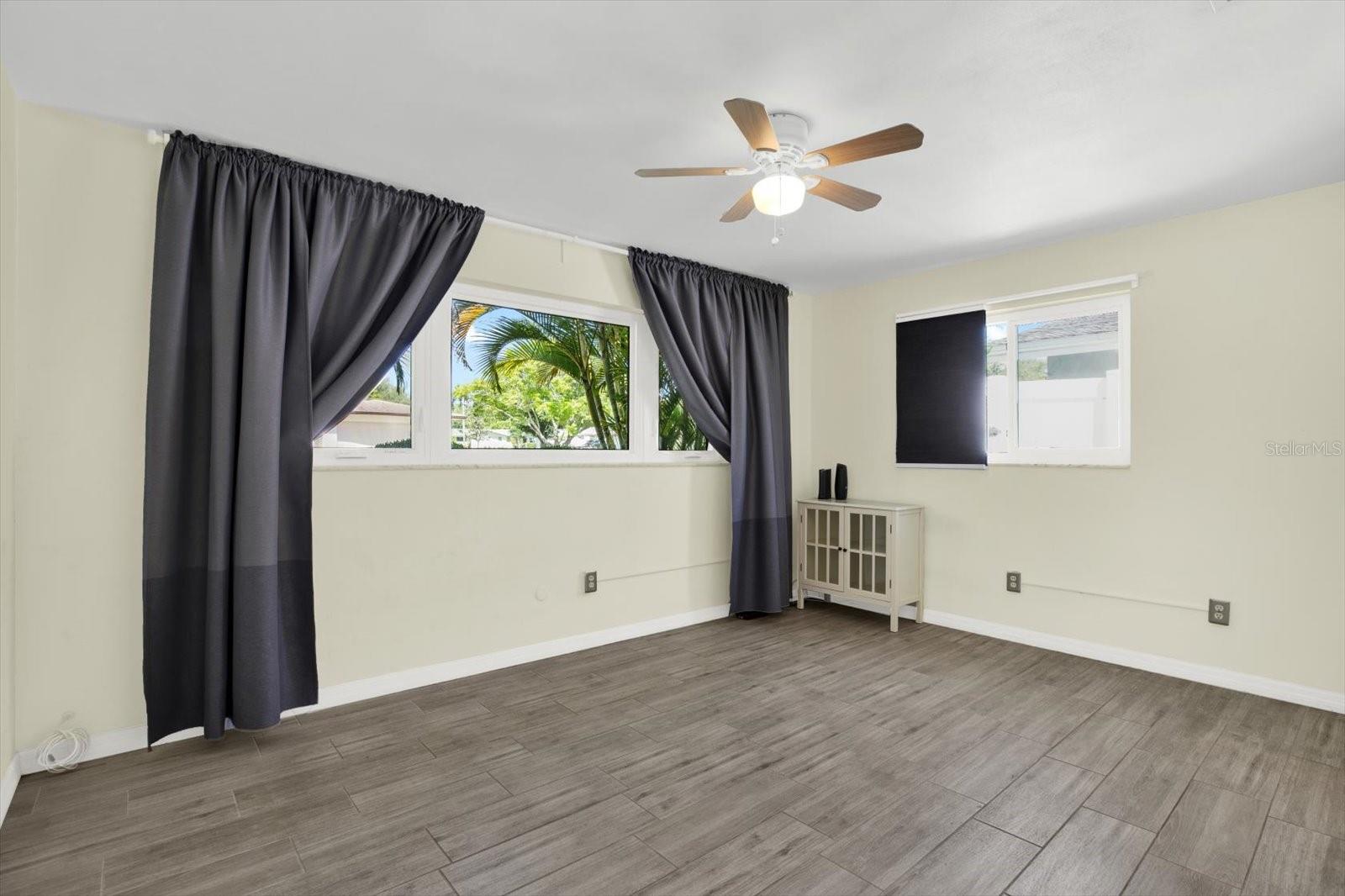 The secondary bedroom also has a large walk-in closet and updated bath is just around the corner
