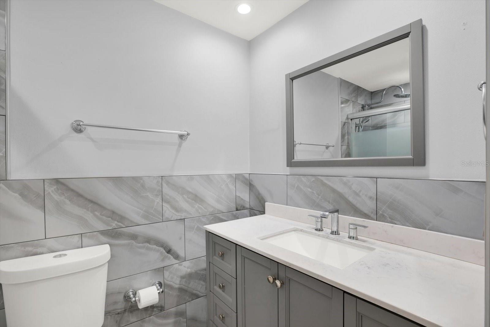 Hall Bath with glass enclosed walk-in shower