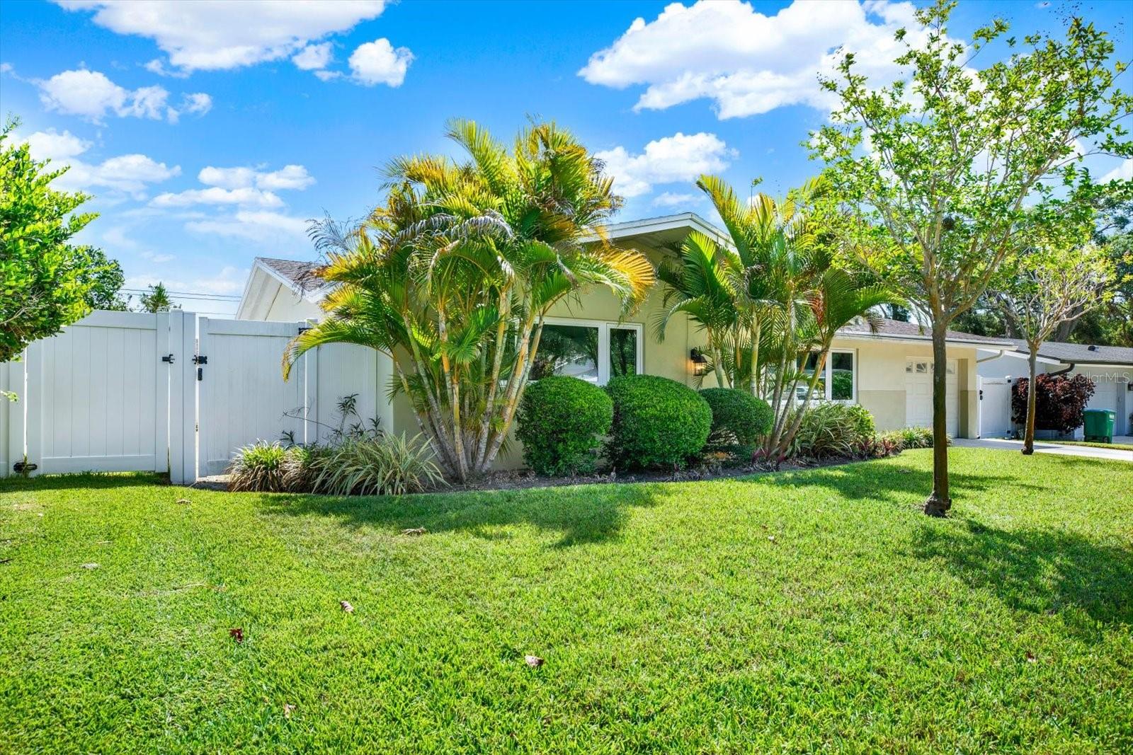 Side yard view with gated side entry