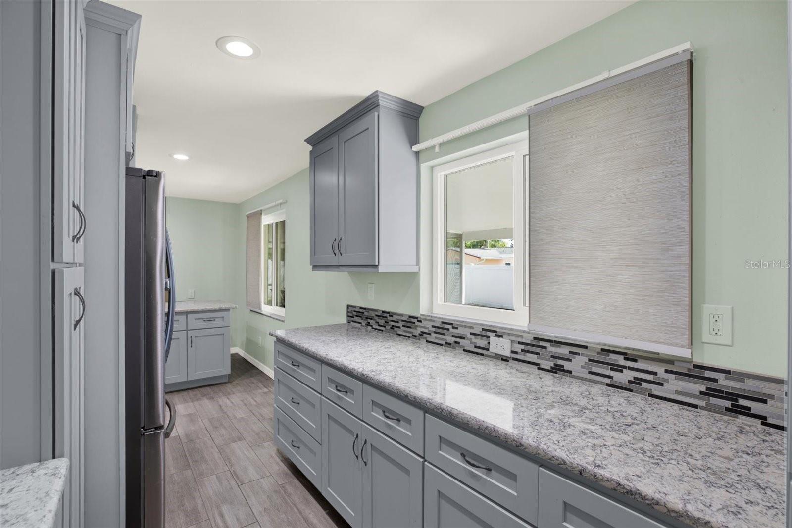 additional counter space acts as a butlers pantry for even more storage and counter space