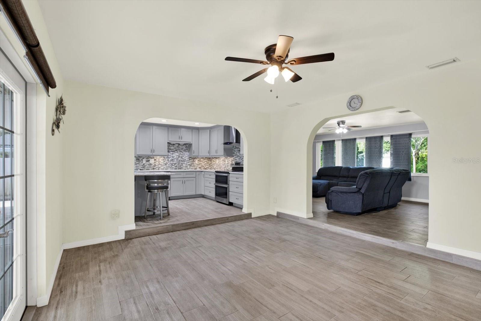 Large dining room opens up your screened enclosed patio with insulated ceiling to stay quiet and cool year round