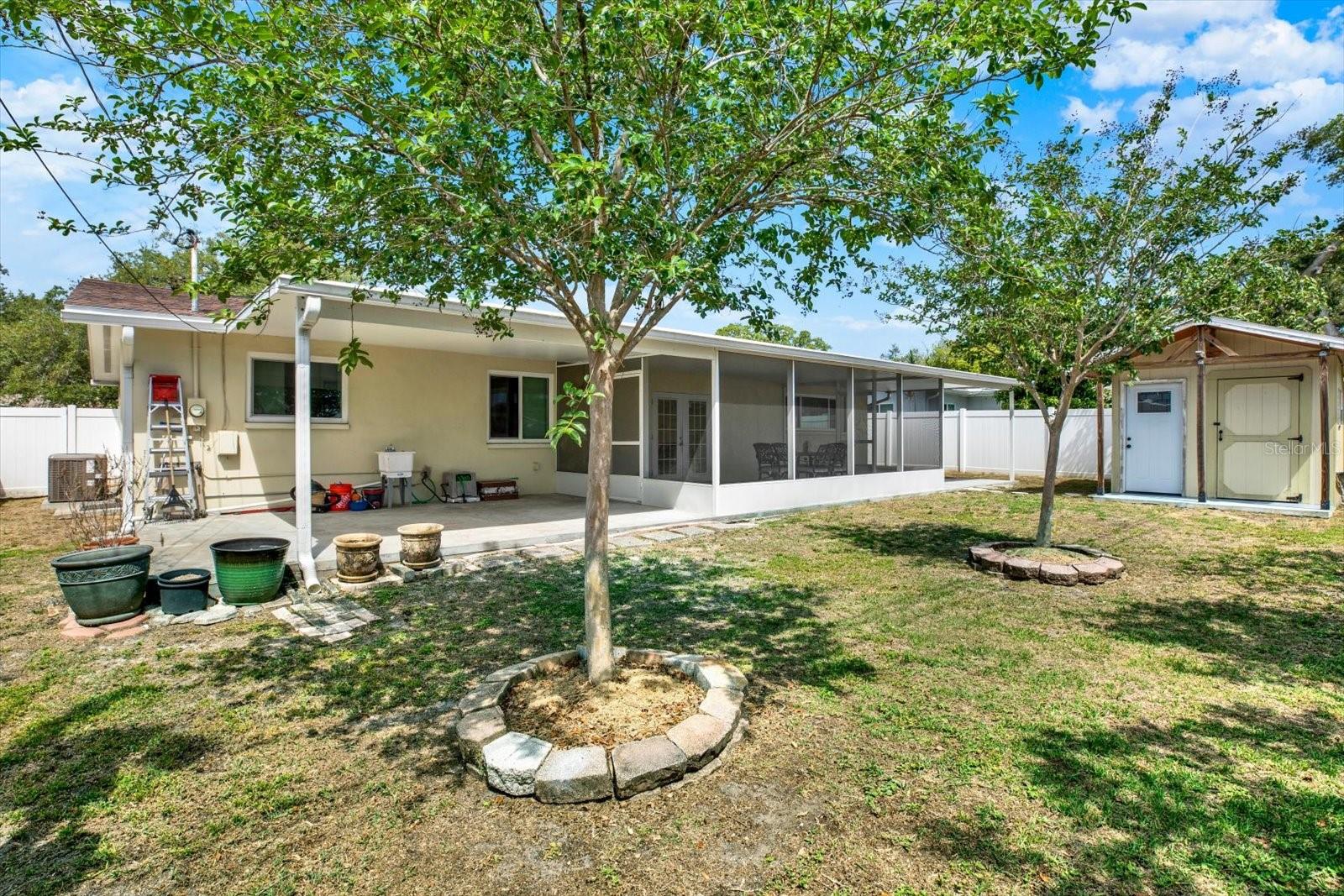Back Yard with expansive covered patios stretching the length of the house