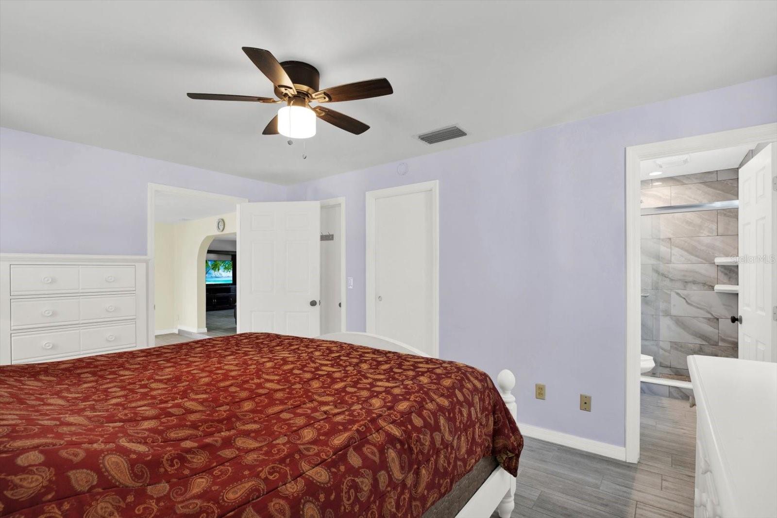 Primary Bedroom walk-n closet and En Suite with custom glass enclosed walk-in shower