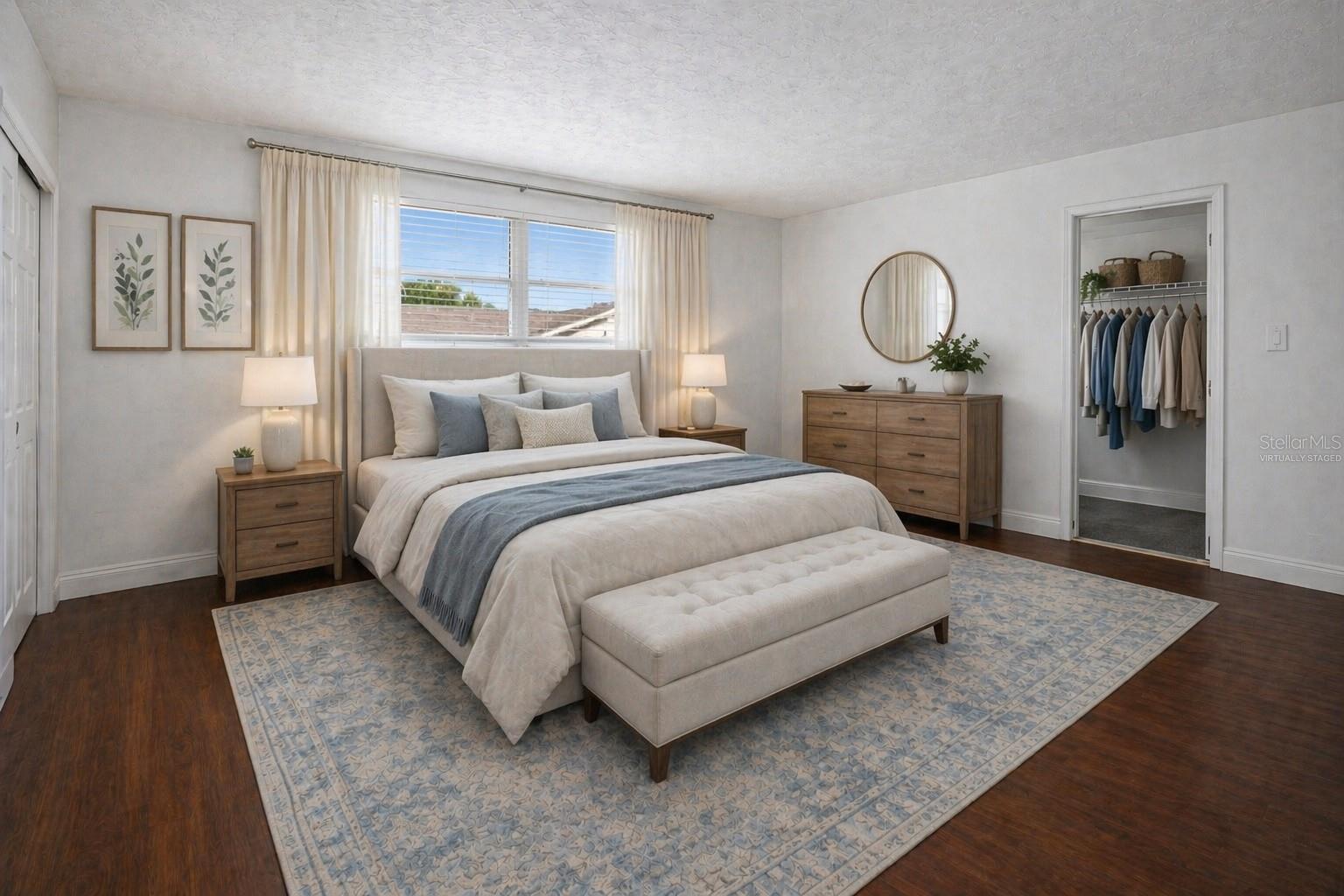 Virtually Staged Primary Bedroom suite with walk-in closets and en-suite bathroom