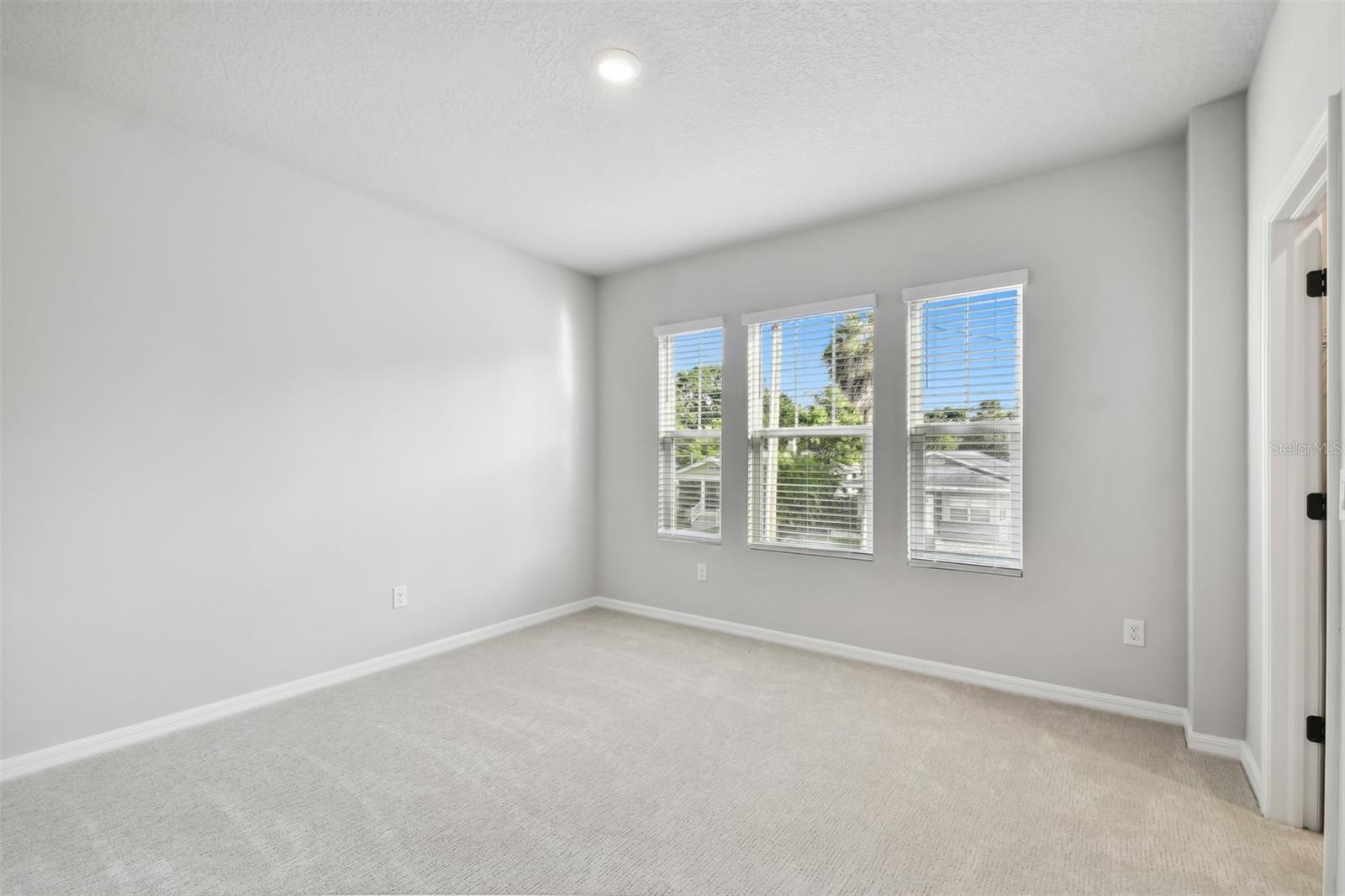 Secondary Bedroom **Photos are of a similar home