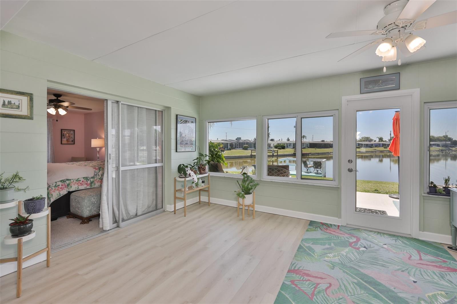Enclosed Lanai, Modern LVT Plank Flooring, Newer Windows, Breathtaking South Lake View