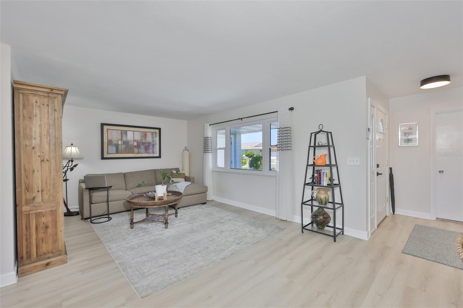 Front Living Room, Modern LVT Plank Flooring Throughout Main Living Area