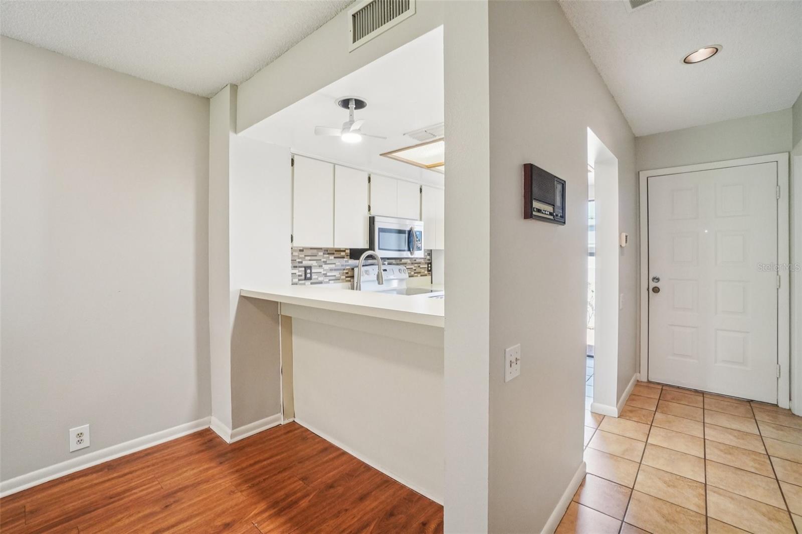 HIGH BAR AT KITCHEN HAS CONVENIENT PASS THOUGH