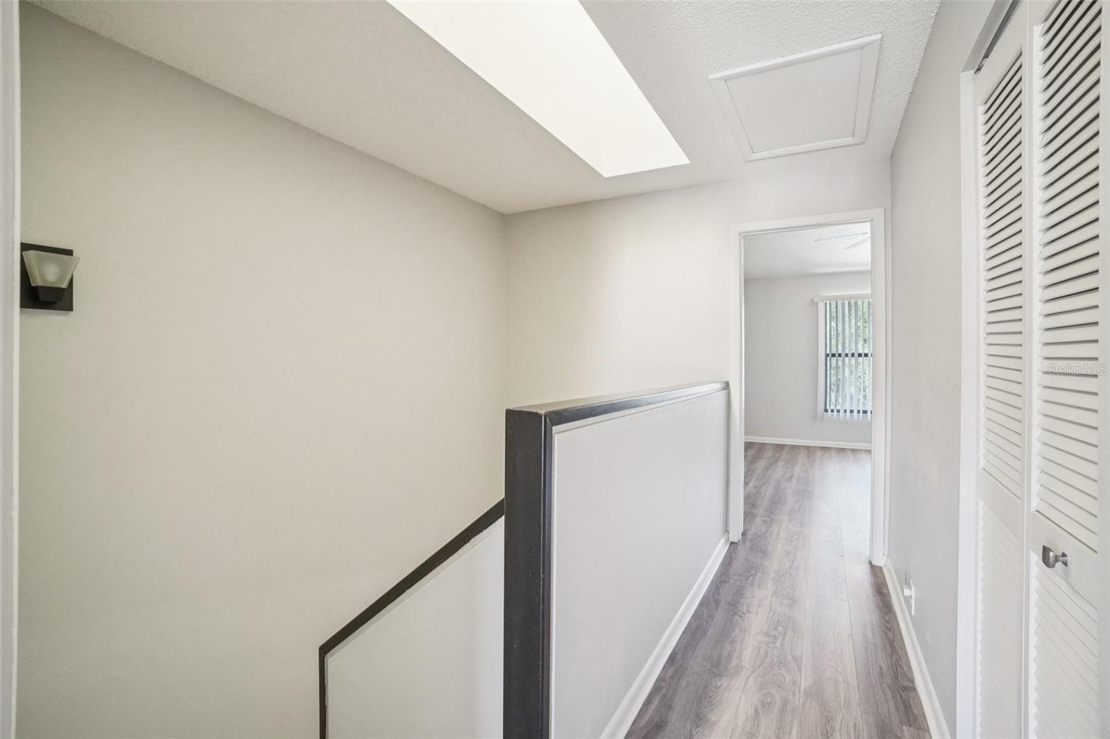 2ND FLOOR HALL WAY SLITS THE UPSTAIRS BEDROOMS FOR MORE PRIVACY