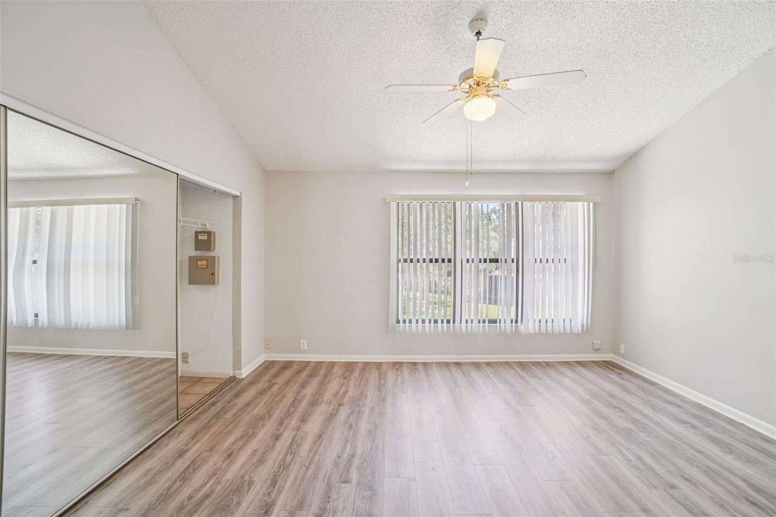 SPACIOUS PRIMARY BEDROOM OVERLOOKS BACK YARD
