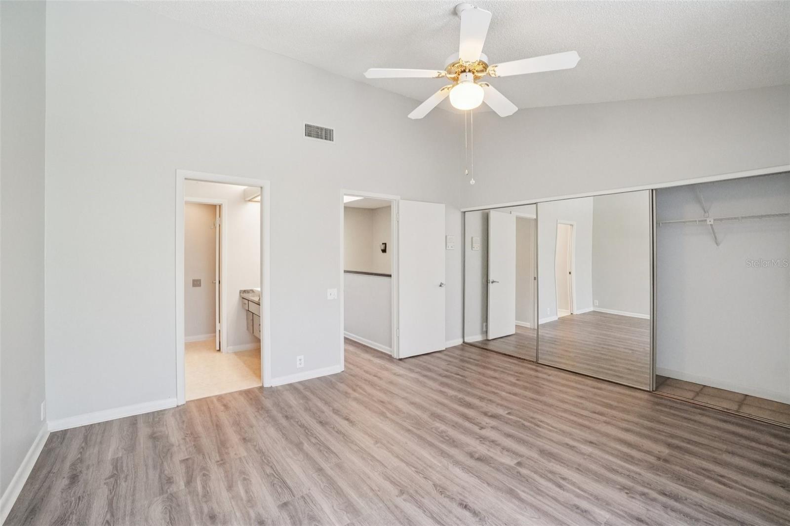 SPACIOUS PRIMARY BEDROOM OVERLOOKS BACK YARD
