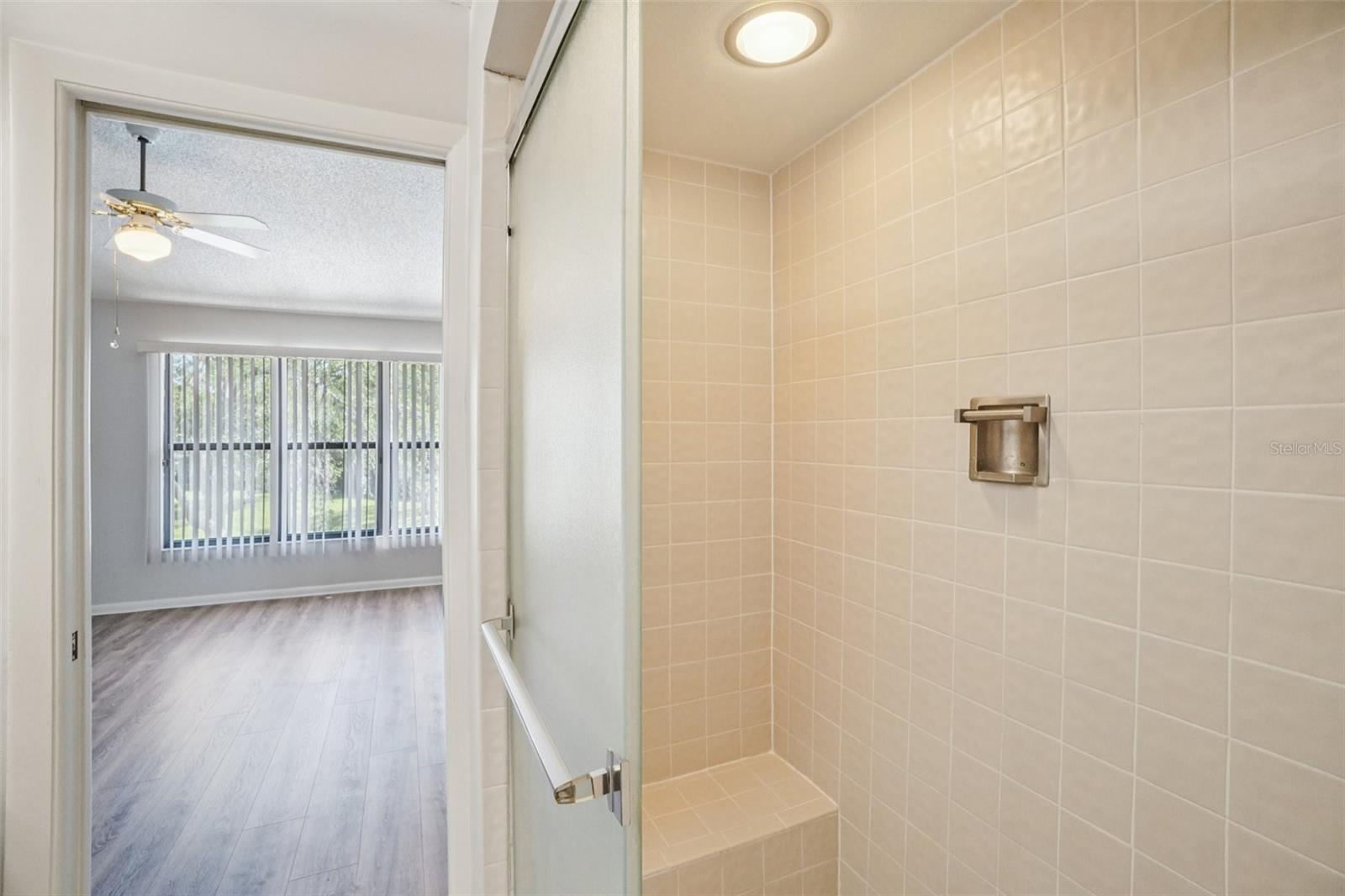 PRIMARY BEDROOM EN-SUITE BATHROOM HAS WALK-IN SHOWER