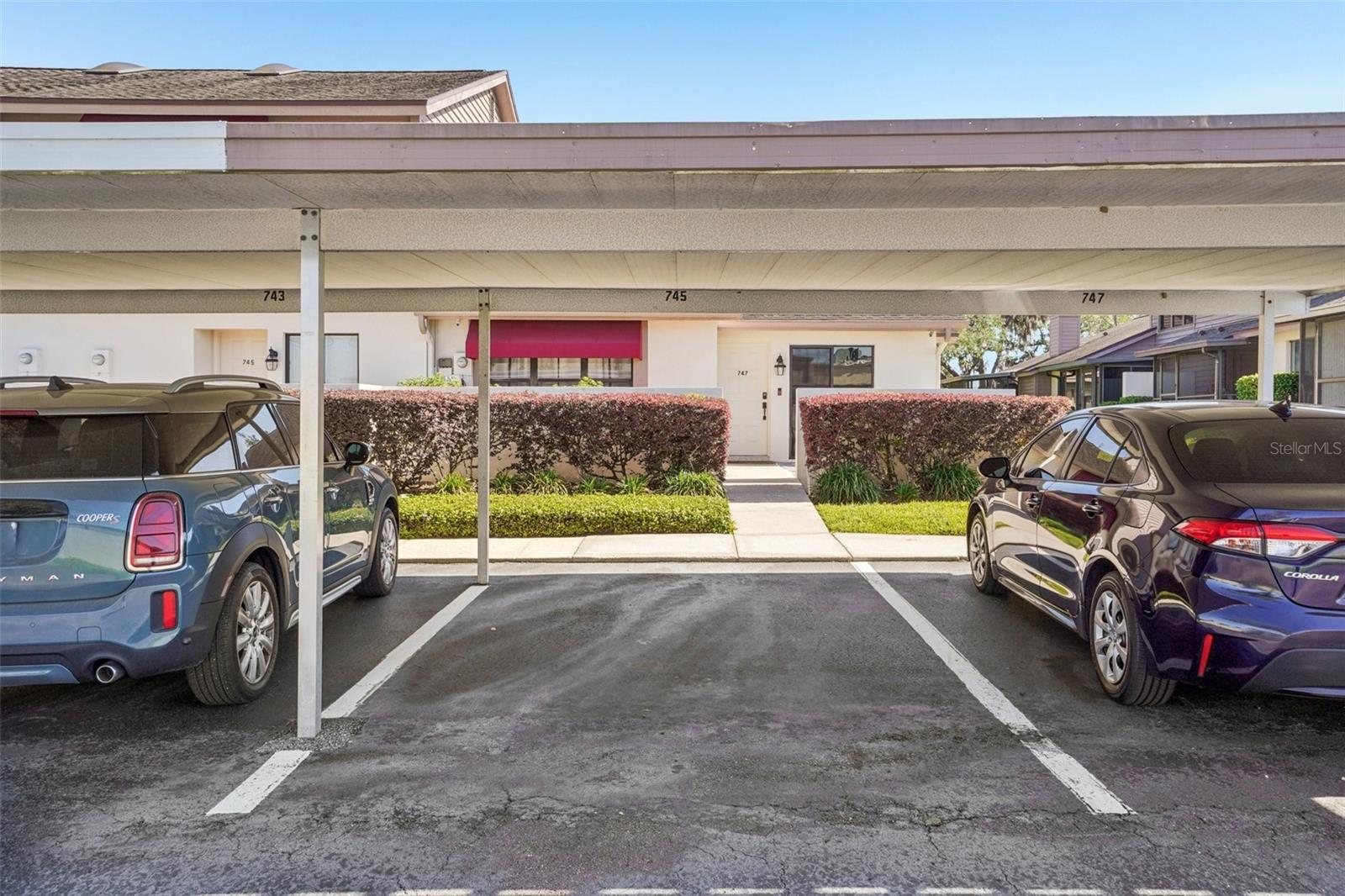 ASSIGNED COVERED PARKING SPACE CONVENIENTLY LOCATED IN FRONT OF THE UNIT