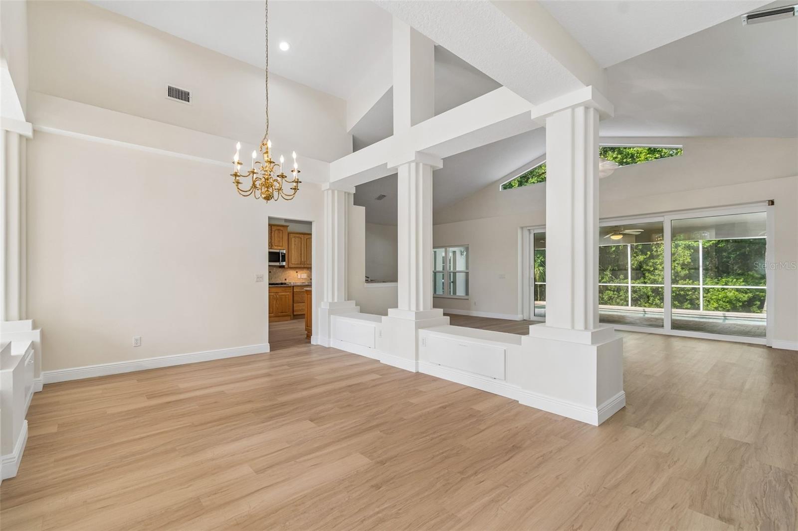 This formal dining room is also bright and airy with lofty ceilings for a spectacular space!