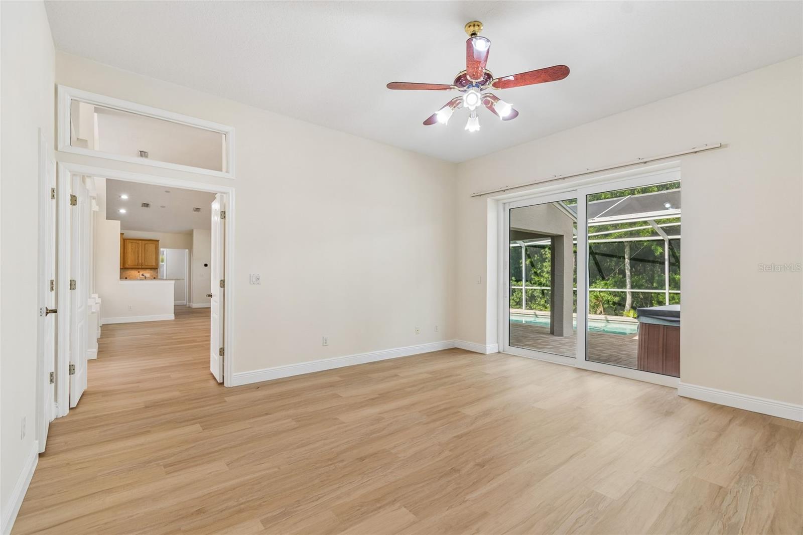 Split bedroom plan offers grand entrance with double doors into the Owner's suite with beautiful views and hurricane impact sliders to patio and pool!