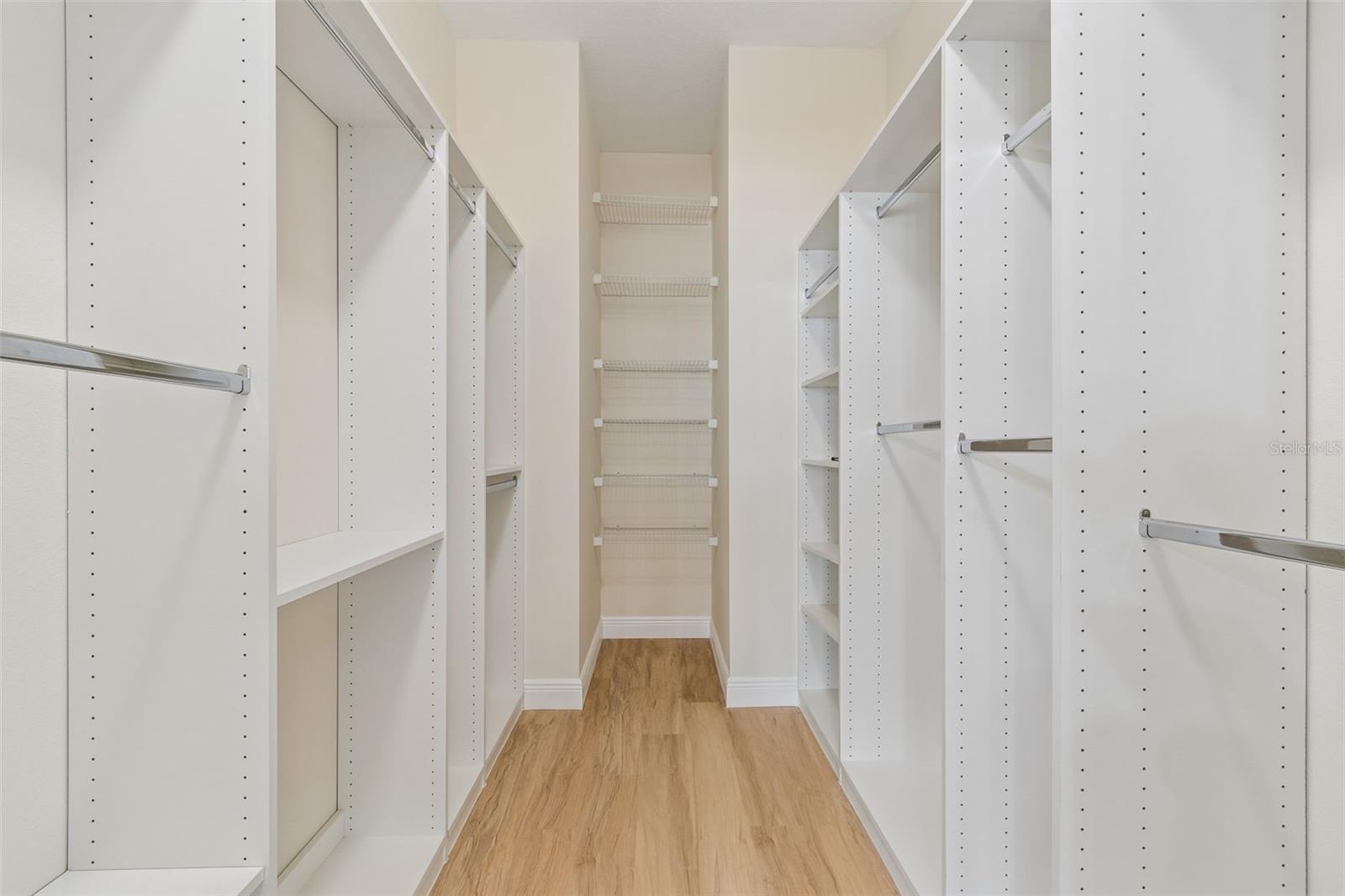 Custom finished primary walk-in closet is 12 ft X 6.5 ft!!