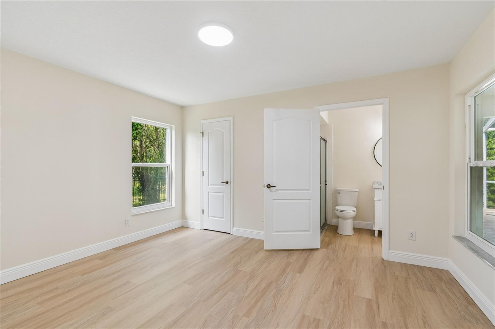 3rd bedroom boasts a remodeled en-suite full bath that also conveniently serves as the pool bath off the patio!