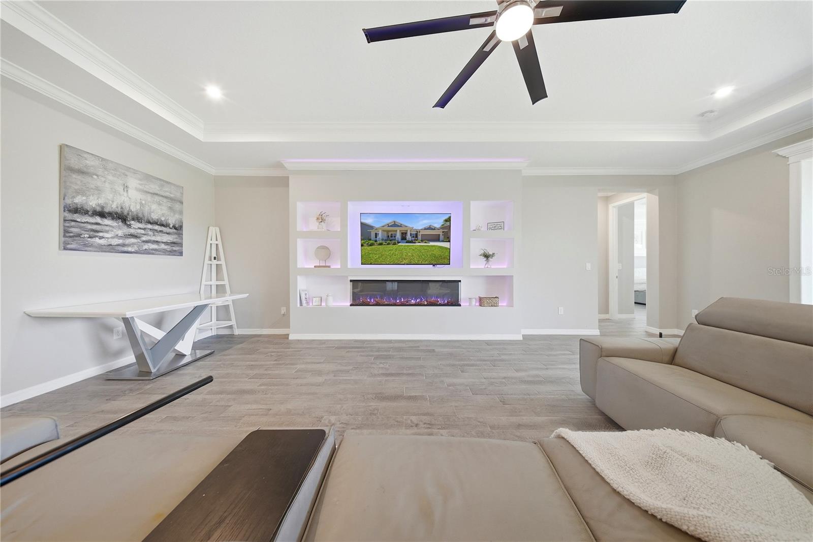 FAMILY ROOM WITH BUILT IN FIREPLACE WALL