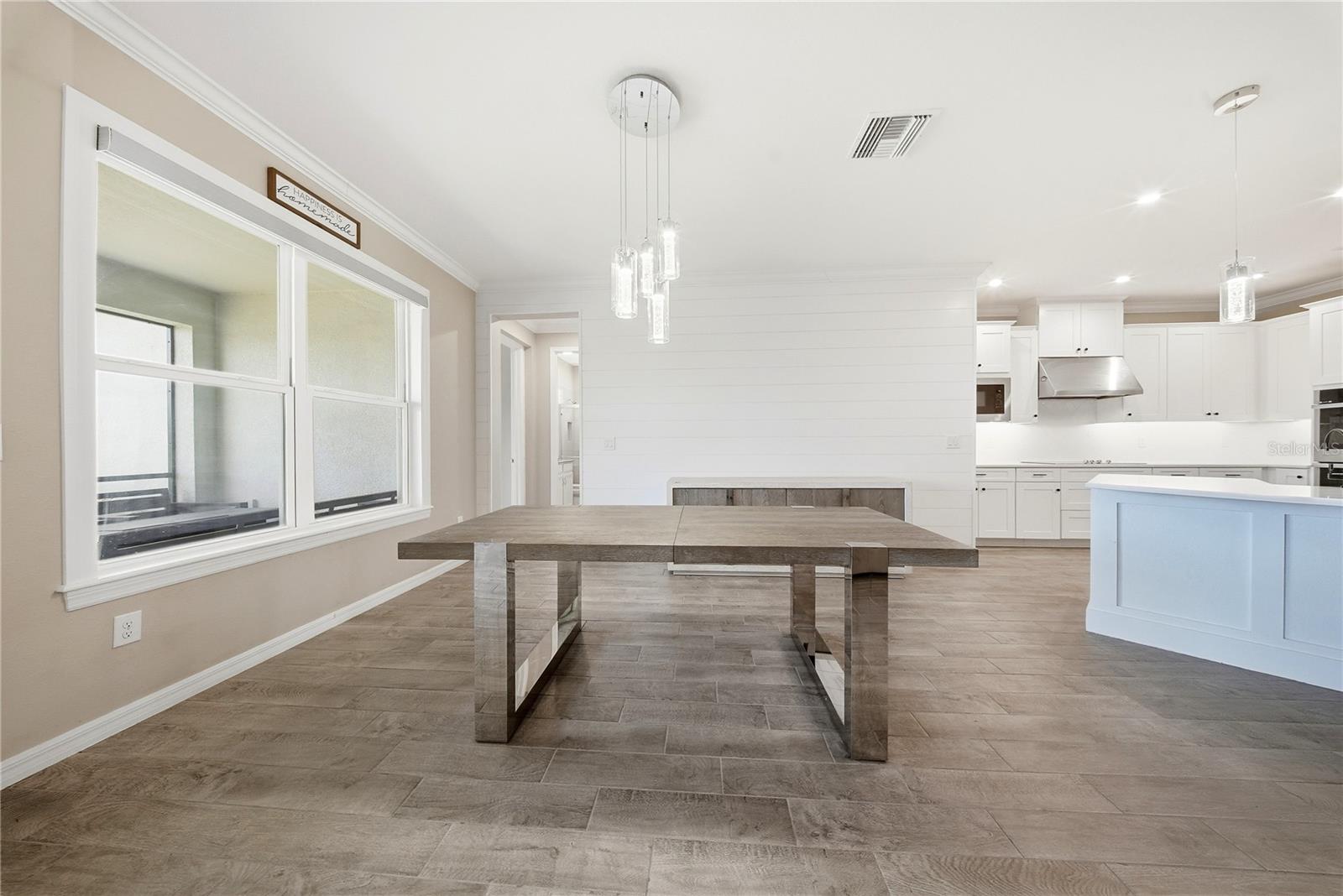 EAT IN BREAKFAST AREA LEADING TO MEDIA ROOM AND 4TH BEDROOM