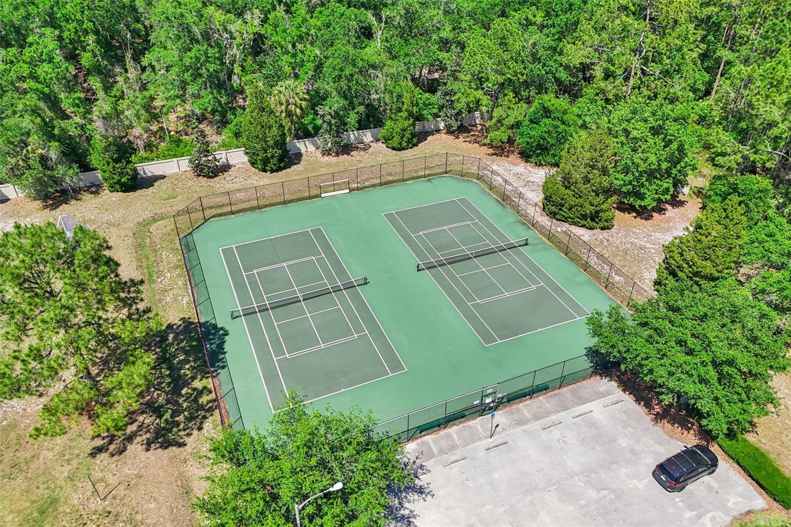 Community tennis courts are directly across from your new home. Look at all that extra parking!