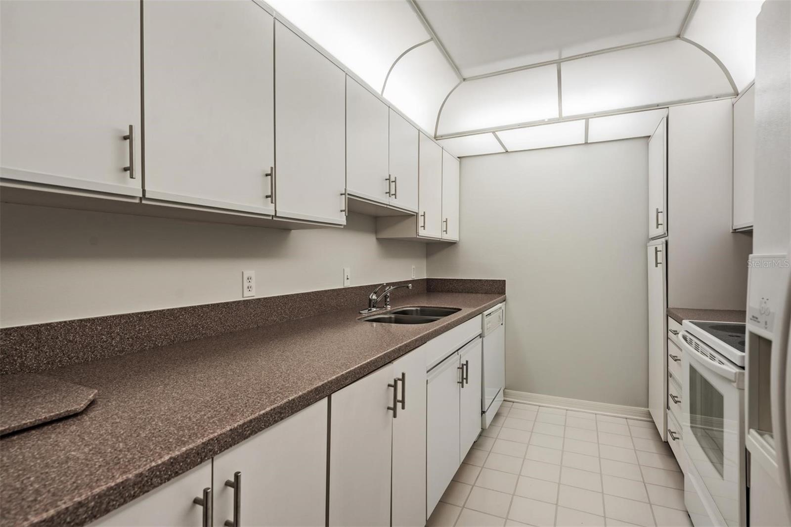 convenience of a private under counter washer and dryer in the kitchen