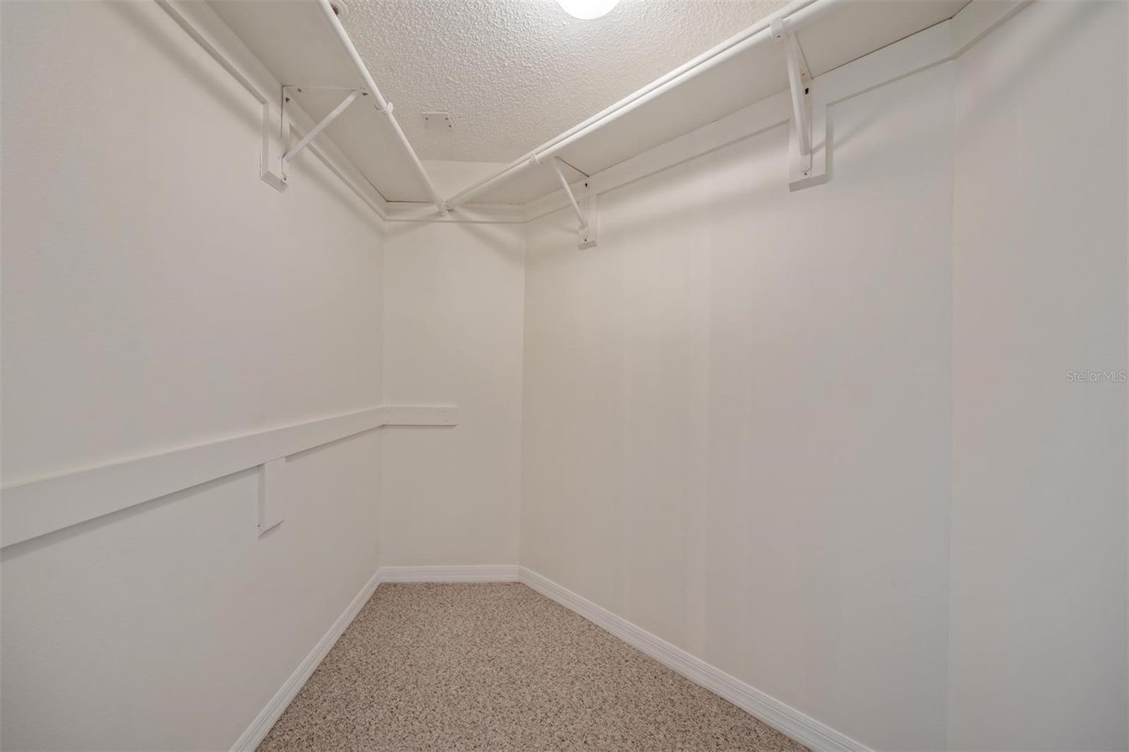 walk in closet in primary suite