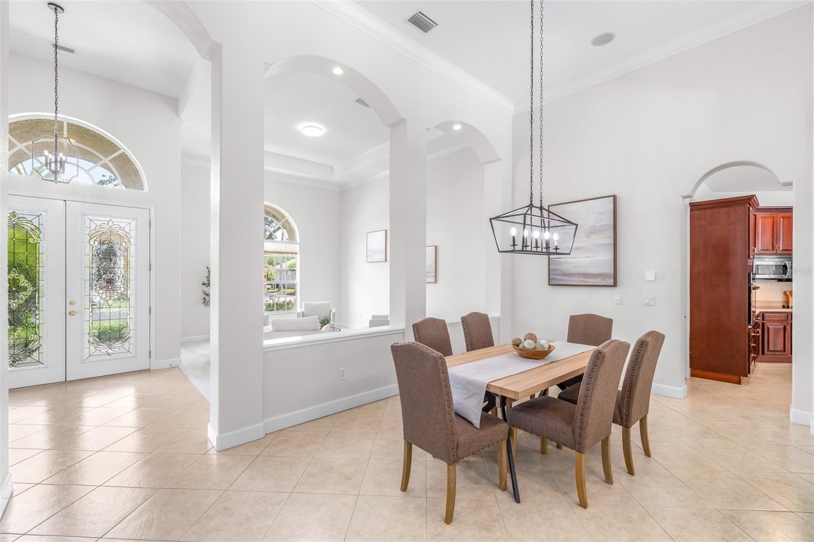 Elegant formal dining area with open flow to main living spaces and kitchen