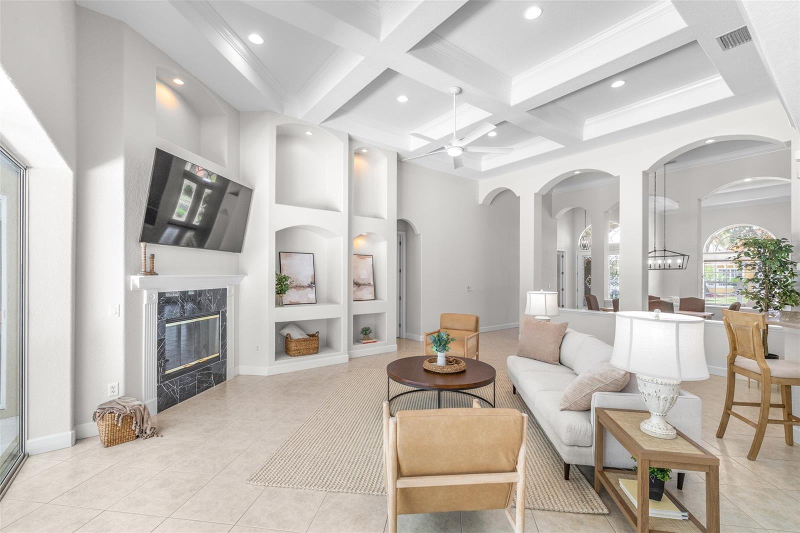 Beautifully designed gathering space with built-in features and wood-burning fireplace