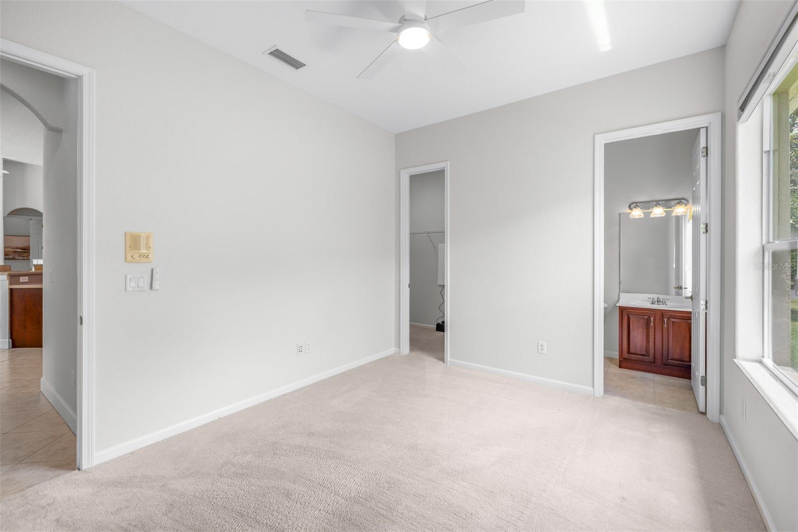 Flexible secondary living space ideal for a media room, fitness area, or guest retreat with en-suite bathroom and large walk-in closet