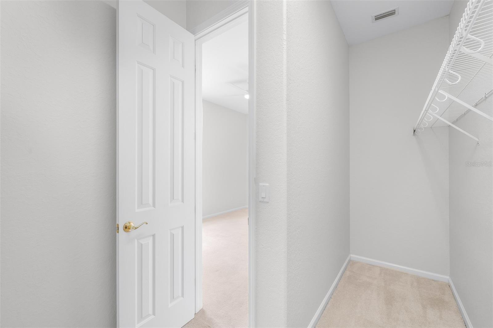 Deep walk-in closet in the secondary bedroom suite area
