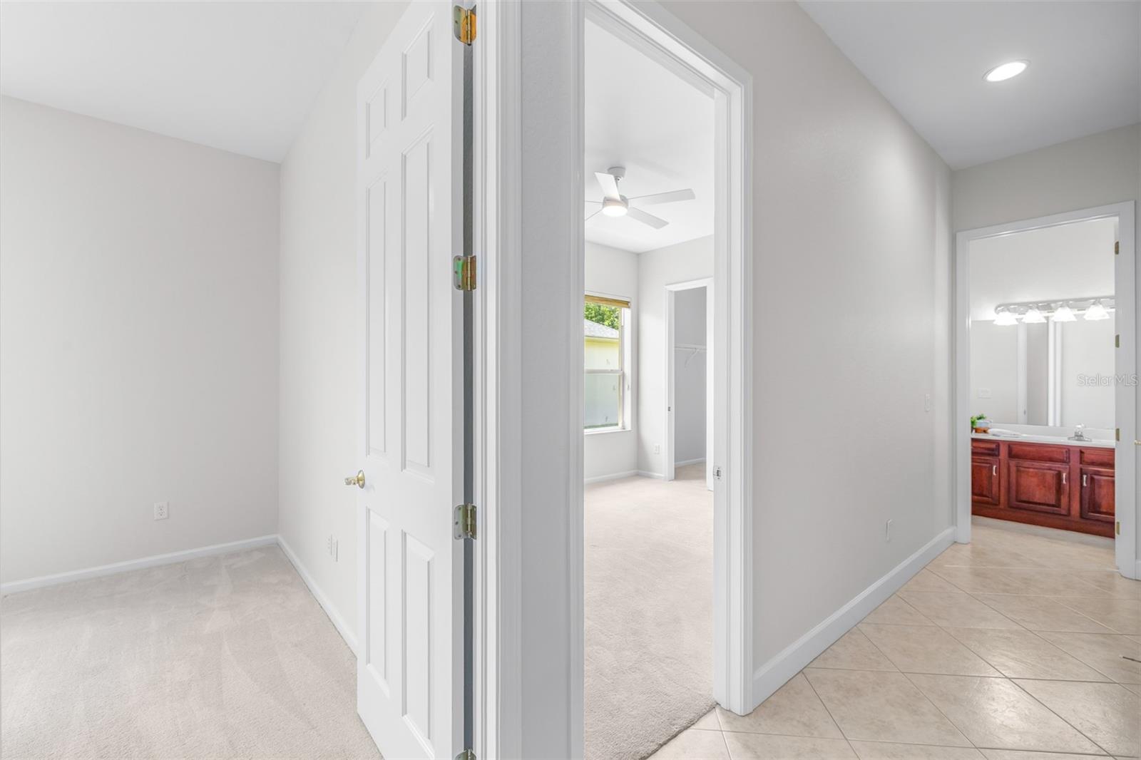 Split floorplan offers secondary bedrooms and bathrooms privately situated in the rear wing of the home