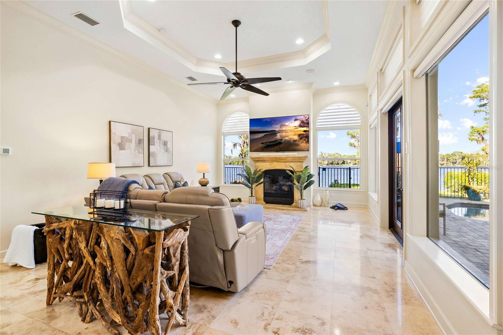 Family Room with Tray Ceilings and Large Windows