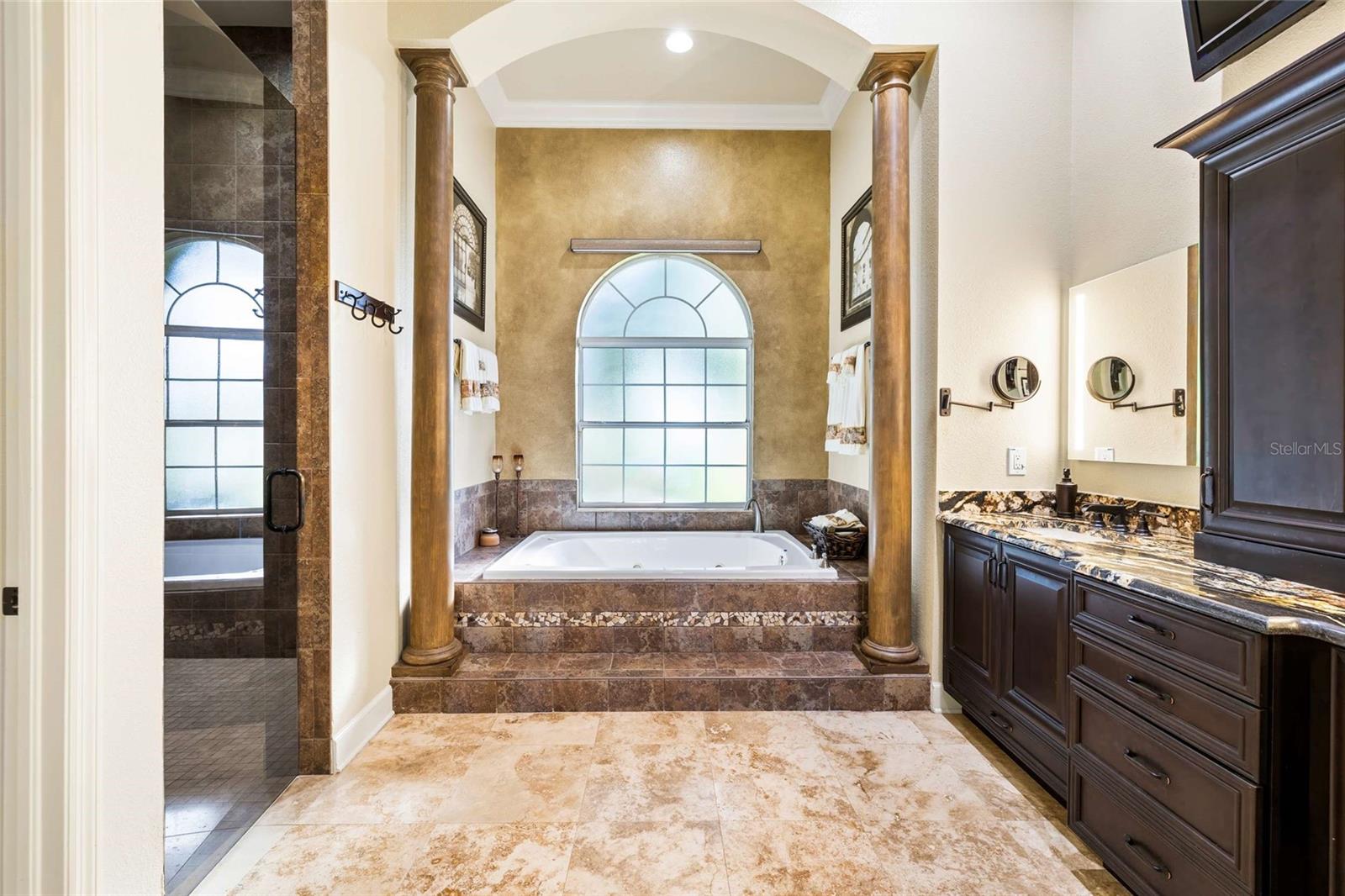 Master Bathroom with Dual Sinks, LED Mirrors, Large Walk in Shower and Jetted Tub.