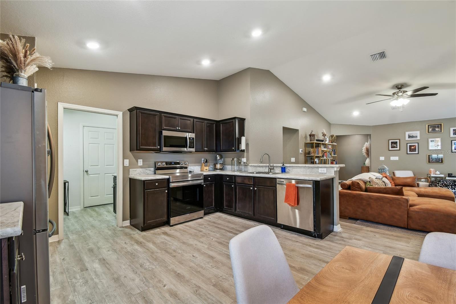 Kitchen with Dark Mocha Cabinets w/ under & over LED lighting