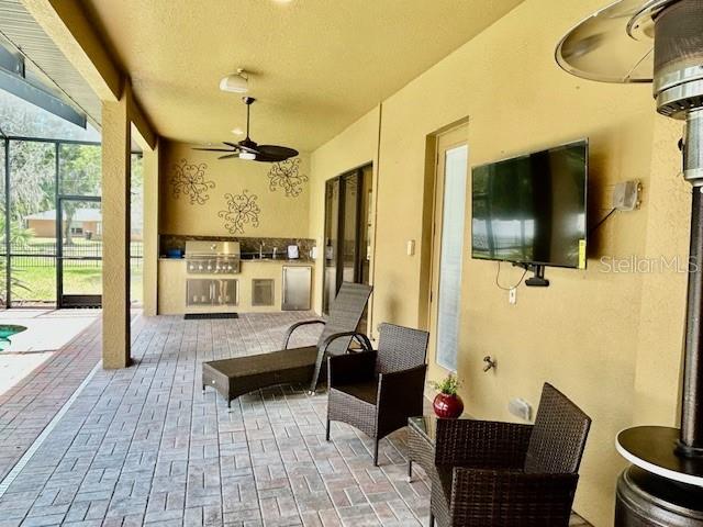 Pool Area w/ Furniture and Outdoor Kitchen
